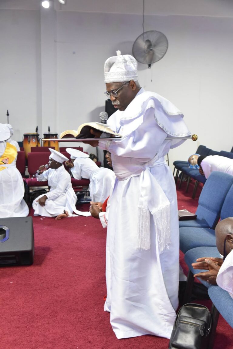 Elder Reading with Sword